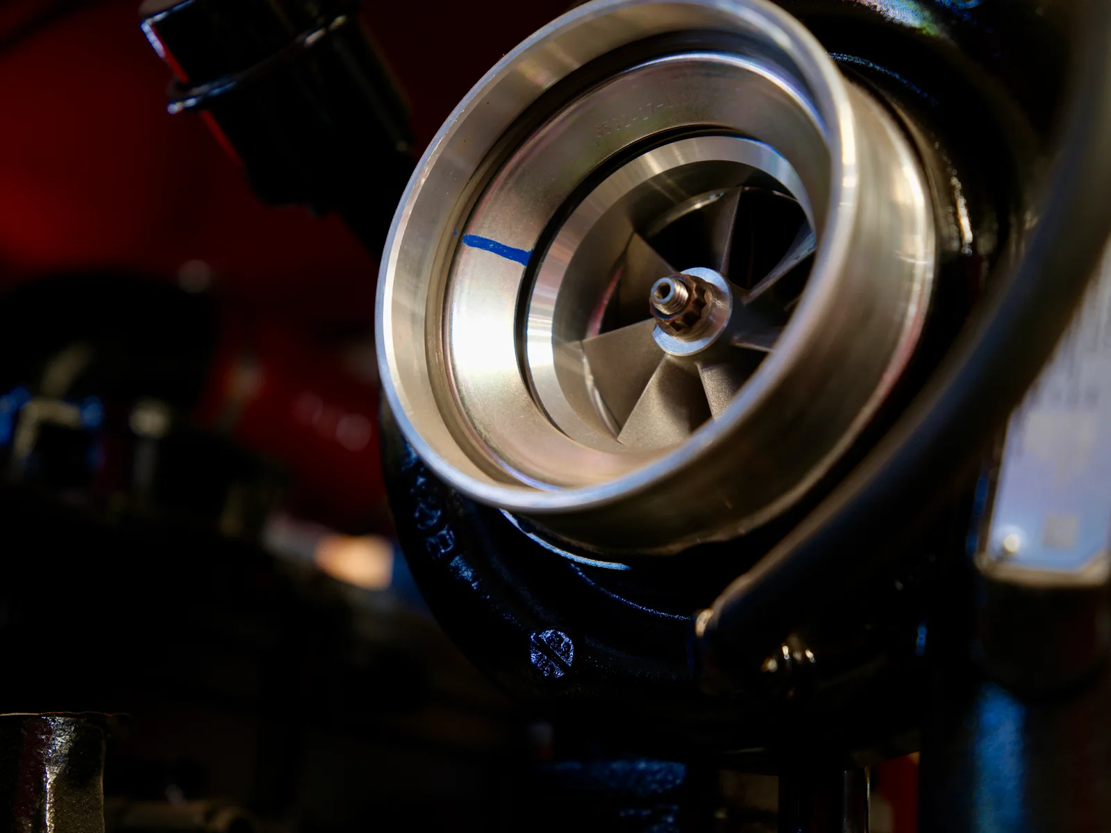 Close-up of metal impeller and red-black mechanical assembly, photographed at GALAXY